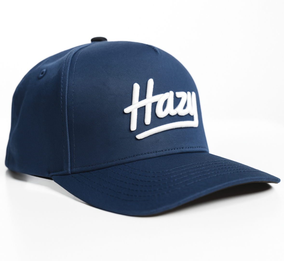 Navy blue cap with 'Hazy' logo on a white background