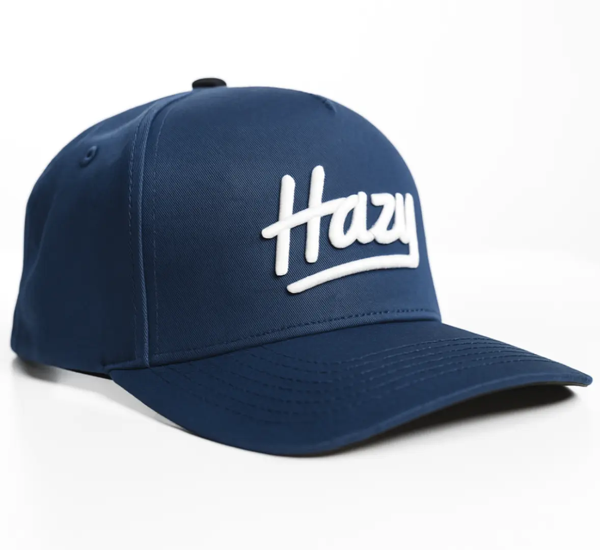 Navy blue cap with 'Hazy' logo on a white background