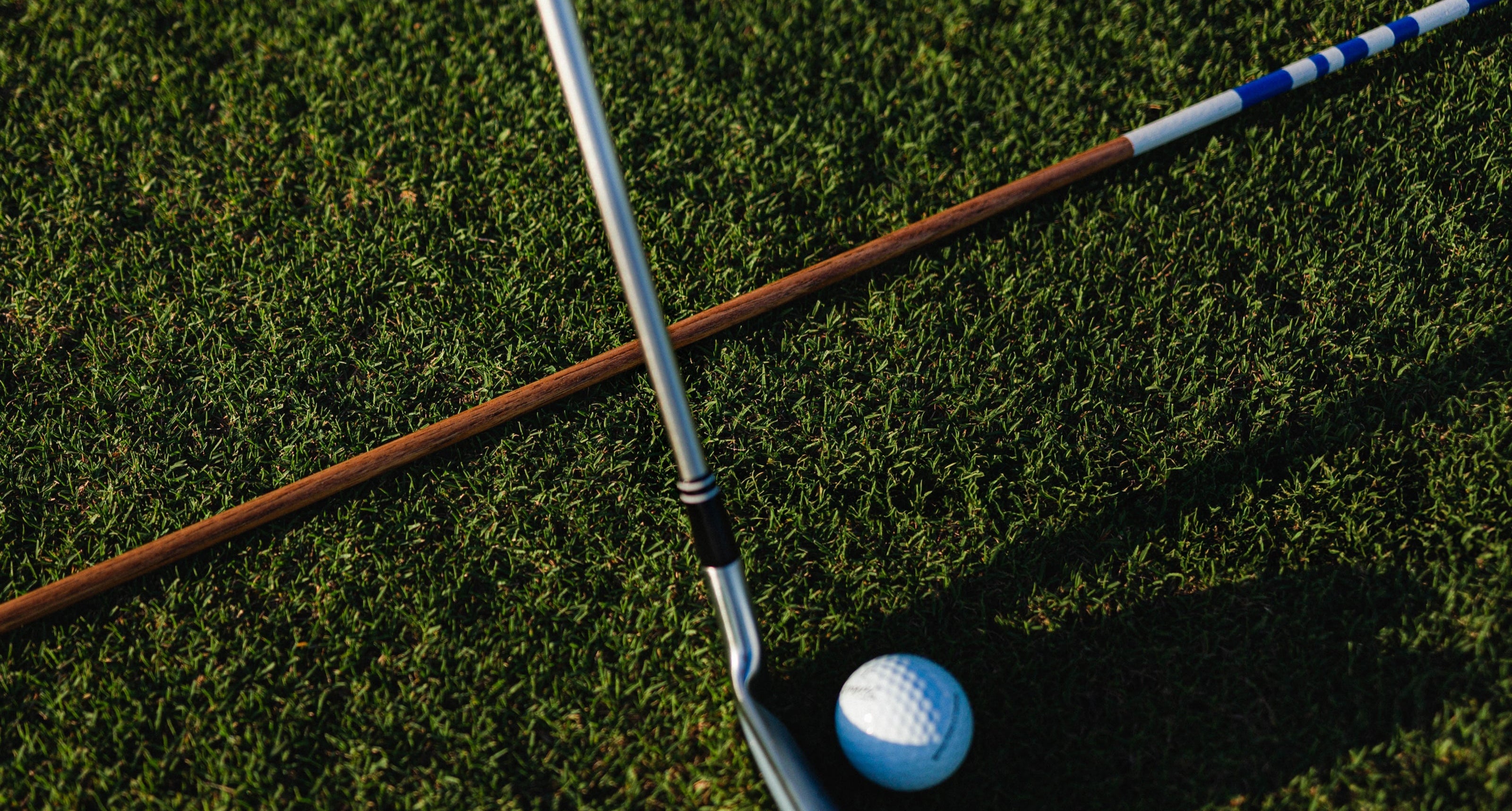 alignment sticks and ball with golf club