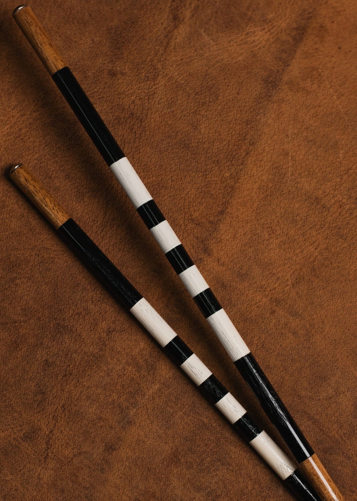 The Renegade handcrafted black and white golf alignment sticks
