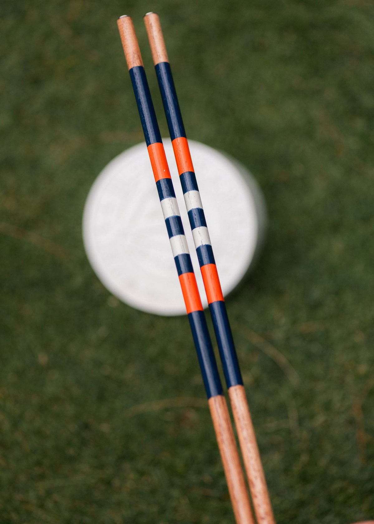 The Doolittle navy orange and white hickory golf alignment sticks